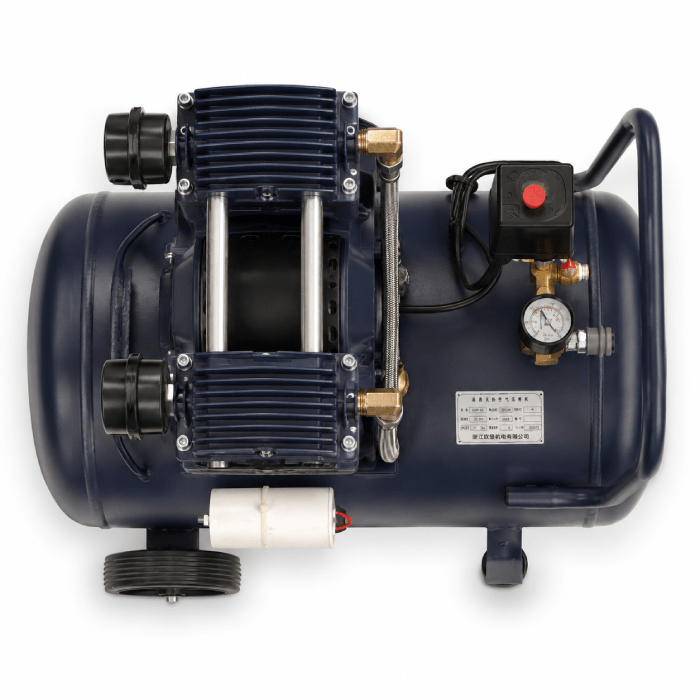 Blue industrial air compressor with a two-piston pump mounted on a cylindrical tank, featuring a red pressure switch, brass fittings, and a gauge on the right side.