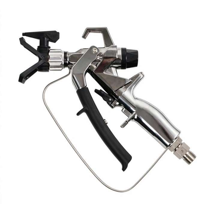 Metal spray gun with black grip and trigger, connected to a hose, used for painting or coating surfaces.